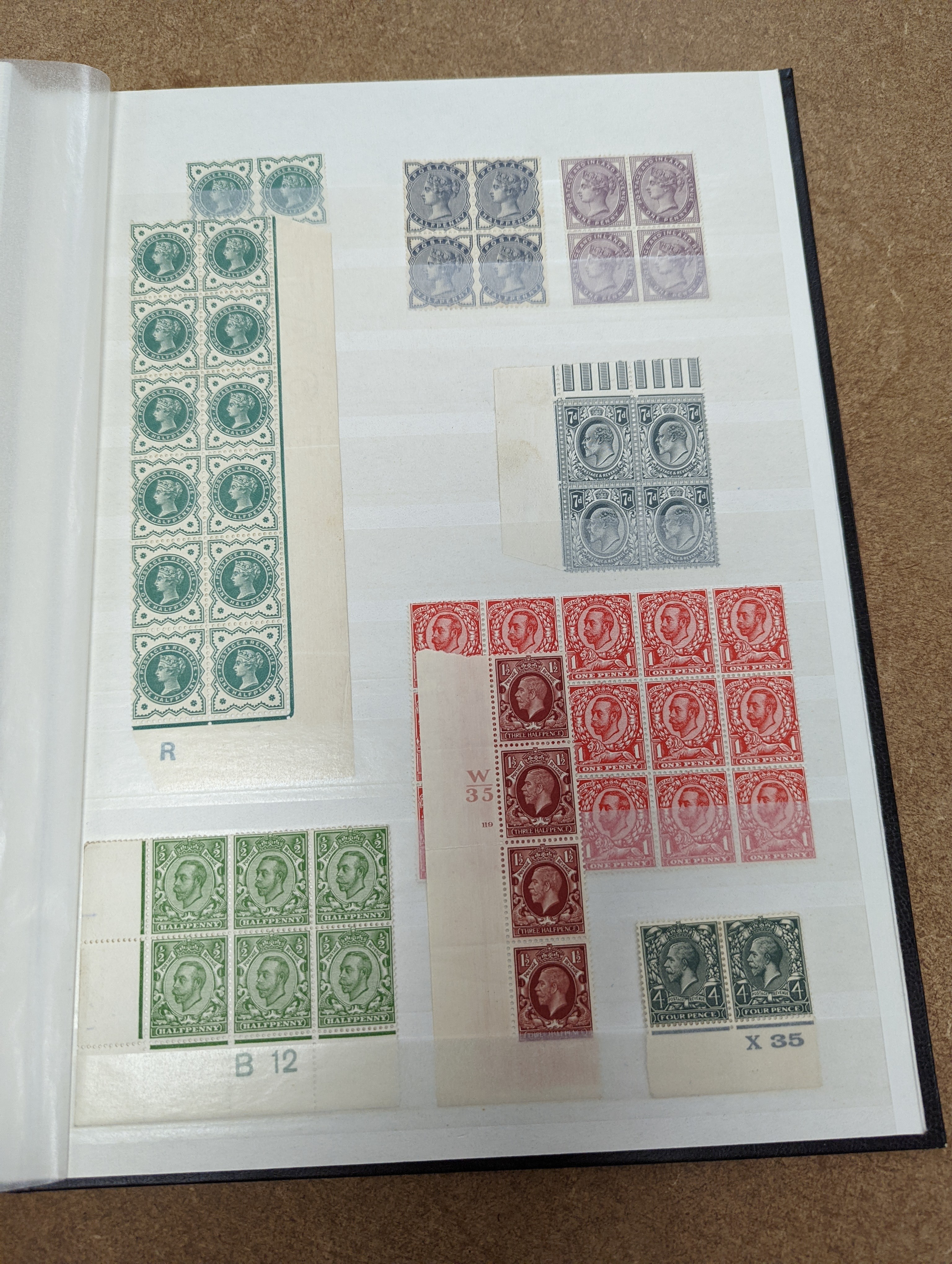 Great Britain stamps in stock book with 1840 1d black and 1841 2d blue unused. 1841 1d red brown mint block of 8, 1864-79 1d red plates in mint blocks including plate 79 block of 48, plate 170 block of 6 with marginal in